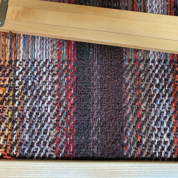 Brown twill rug partly woven